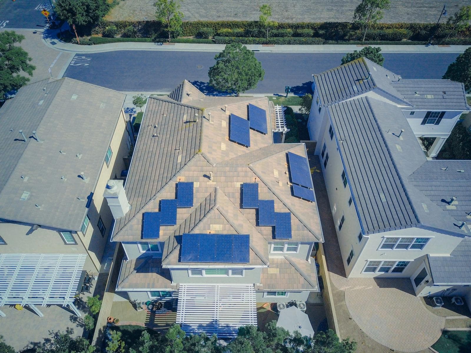 Aerial view of a suburban home with solar panels on its roof